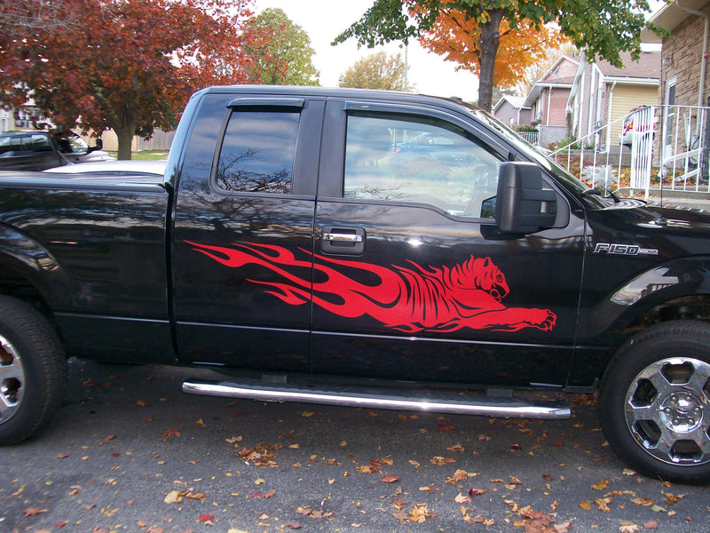 red tiger flames decal on black truck